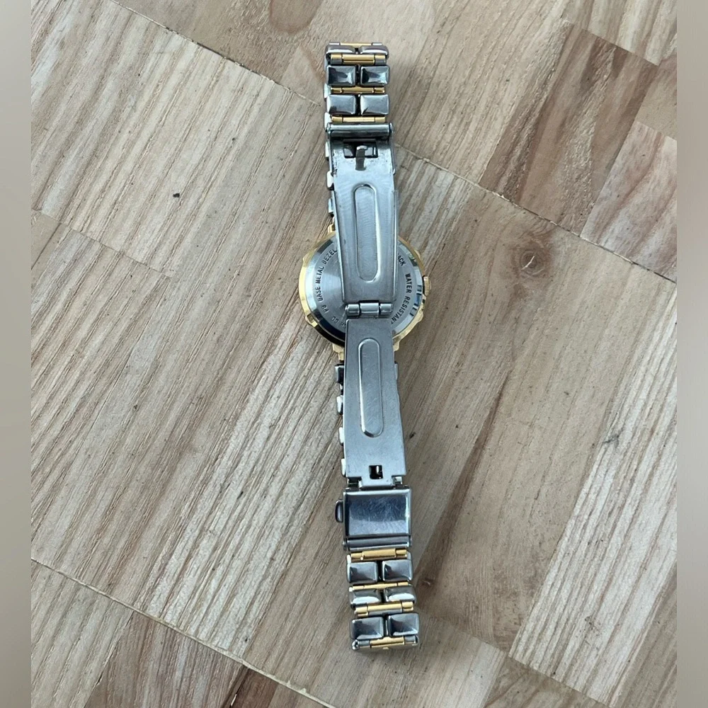 Bulova Ladies Watch Two-Tone Bracelet Case Sparkling Silver Dial Gold-Tone Hands